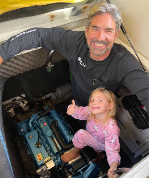 Brian Trautman from SV Delos and his daughter next to a recently installed NANNI N4.80 marine diesel engine